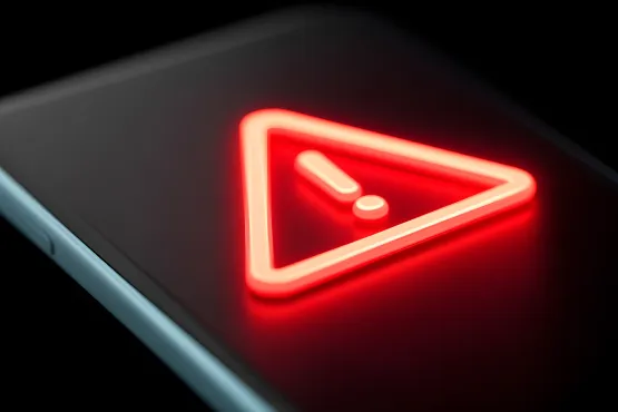 Icône de triangle rouge avec point d’exclamation affichée sur un téléphone
